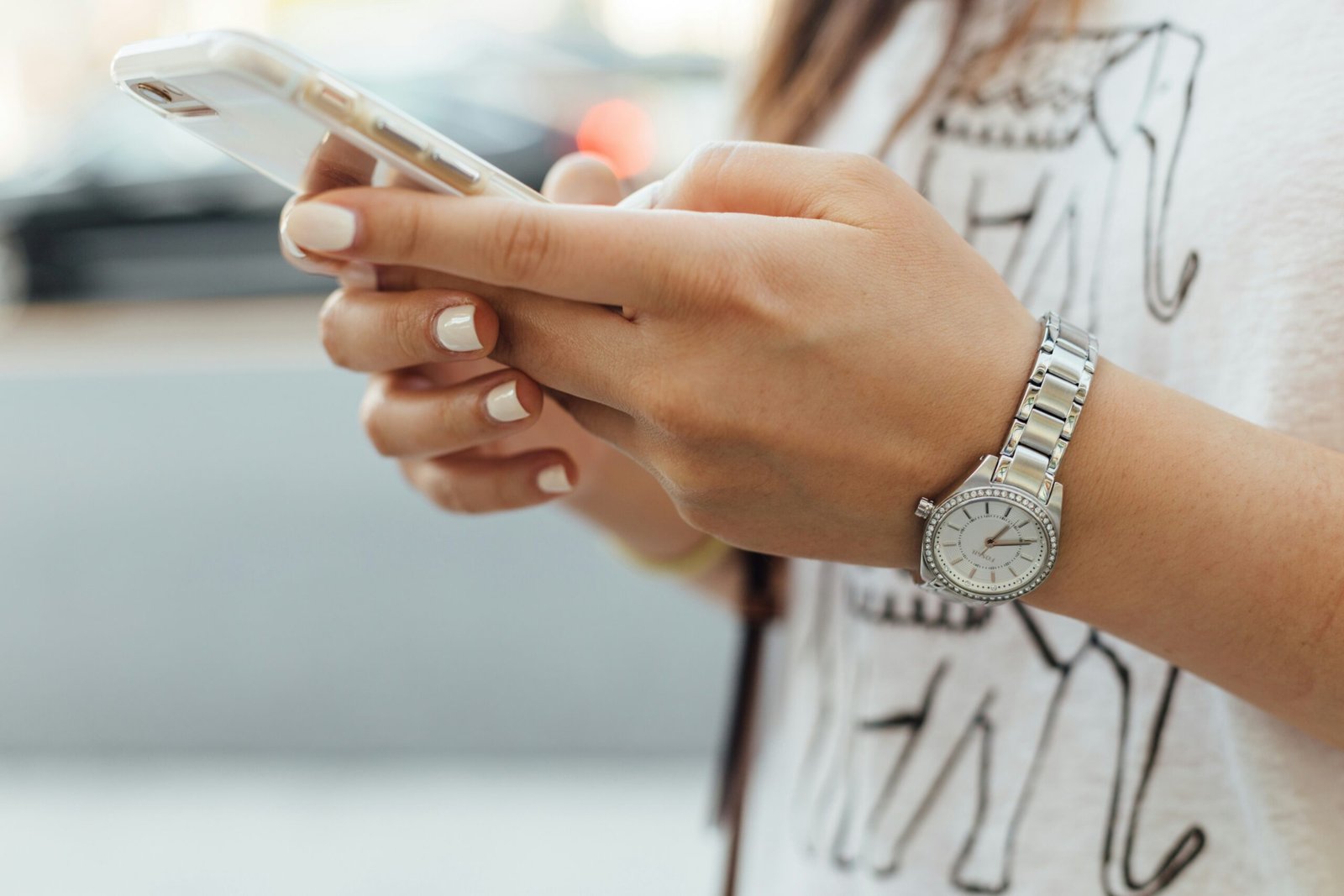 woman holding iphone during